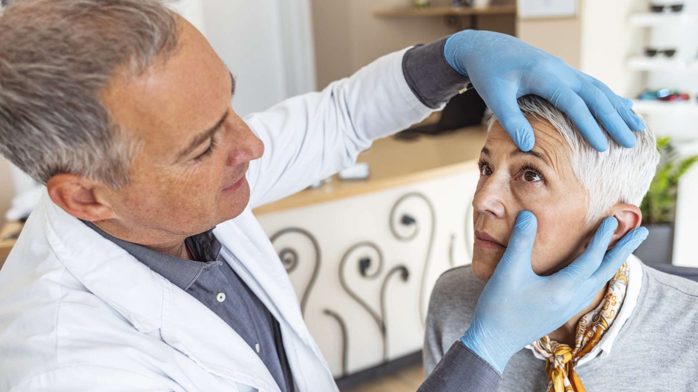 Senior woman getting eye exam